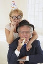 Amusing senior couple partying Royalty Free Stock Photo