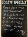 An amusing Sign depicting the value of money compared with oxygen in life