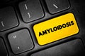 Amyloidosis is a disease that occurs when a protein called amyloid builds up in organs, text button on keyboard, concept