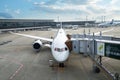 An ANA airplane loading off its passengers and cargo at Narita International Airport Royalty Free Stock Photo