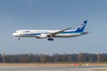 ANA All Nippon Airways Boeing 787-9 Dreamliner with the aircraft registration JA836A in the approach to the northern runway 26R of Royalty Free Stock Photo