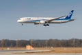 ANA All Nippon Airways Boeing 787-9 Dreamliner with the aircraft registration JA836A in the approach to the northern runway 26R of Royalty Free Stock Photo