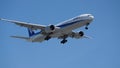 ANA Boeing 777 Airplane prepares for landing. Royalty Free Stock Photo