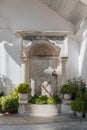 Ornate drinking fountain in Panagia Tourliani Monastery, Ana Mera, Mykonos, Greece