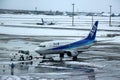 ANA Taxing at Chitose airport on a snowy day Sapporo