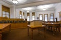 The lectern and jury box in the courtroom at the Deer Lodge County Courthouse, Anaconda, Montana, USA Royalty Free Stock Photo