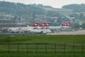 Anadolu jet and different Swiss aircraft at the gate in Zurich in Switzerland