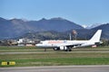 A Anadolujet airplane on the airport runway in Bergamo International Airport. Royalty Free Stock Photo