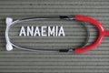 Anaemia- text from white letters on green background with stethoscope, medical concept diagnostics