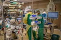 Anaesthesiologist in protective gear ventilating a Covid-19 patient in an operating room