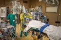 Anaesthesiologist in protective gear ventilating a Covid-19 patient in an operating room