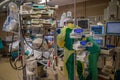 Anaesthesiologist in protective gear ventilating a Covid-19 patient in an operating room