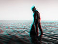 Anaglyph effect of man in a diving suit with flippers.