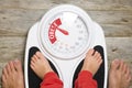 Analog bathroom scale indicating child obesity Royalty Free Stock Photo