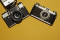 Analog cameras on yellow background. copy space