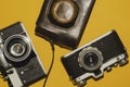 Analog cameras on yellow background. copy space