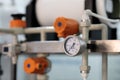 Analog pressure gauge and plastic pipe system Royalty Free Stock Photo