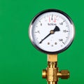Analog Pressure Gauge on a Green Background Royalty Free Stock Photo