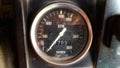 The analog speedometer display on the generator engine shows the RPM speed