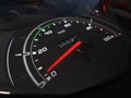 An analog speedometer with fuel gauge Royalty Free Stock Photo