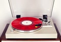 Analog Stereo Turntable Red Vinyl Record Player with Red Disk Royalty Free Stock Photo