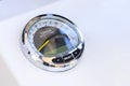 Analog tachometer on the white dashboard control panel of the motor boat Royalty Free Stock Photo