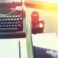 Analog Typewriter, Digital Tablet And Film Camera On The Green Table, Top View with Sunshine. Journalism Writing Concept