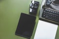 Analog Typewriter, Digital Tablet And Film Camera On The Green Table, Top View