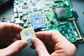 Analysis (installing) of processor in CPU socket Royalty Free Stock Photo