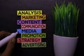 Analysis, Marketing, Content, Communication, Media, Promotion, Strategy, Advertising text on sticky notes isolated on Black desk.