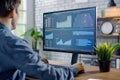 Analyst Reviews Data Charts and Graphs on a Computer Screen, Examining Business Trends and Growth Metrics for Strat