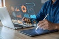 An analyst uses a computer and dashboard for data business analysis and data management system, customers database