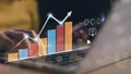 An analyst uses a computer and dashboard for data business analysis and a Data Management System with KPI and metrics connected to Royalty Free Stock Photo
