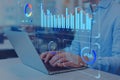 Analyst working on business analytics dashboard with KPI, charts and metrics to analyze data and create insight reports for Royalty Free Stock Photo