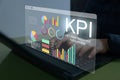 Analyst working with Business Analytics and Data Management System on computer to make report with KPI and metrics connected to Royalty Free Stock Photo