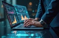 Analyst works with data visualization on laptop. Financial analyst using futuristic interface screen. Man in suit works with Royalty Free Stock Photo
