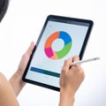 Analyzing Business Data on a Digital Tablet with Stylus Royalty Free Stock Photo
