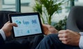 Analyzing financial data on tablet computer screen Royalty Free Stock Photo