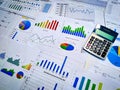 analyzing income charts and graphs with calculator. Close up. Business financial analysis and strategy concept. Royalty Free Stock Photo