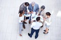 Analyzing the quarterly results. a group of diverse businesspeople discussing paperwork in a meeting. Royalty Free Stock Photo