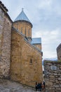 Ananuri, Georgia : 20-11-2022 : amazing view of the Ananuri castle complex with church on the Aragvi River in Georgia in a cloudy