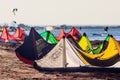 Colorful kites resting on sandy beach of Blac Sea coast at sunset