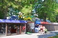 Anapa, Russia, July, 14, 2018. Family with two children walking past the entrance to the Dinosaur park in Anapa