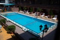 Anapa, Russia - May 1, 2020: An empty courtyard with an open pool without people. Preparation for a new tourist season after