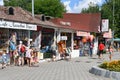 Anapa, Russia, July, 16, 2018. People walking near cafe `Tender coast 1` and small shops with Souvenirs and beach accessories at a Royalty Free Stock Photo
