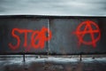 Anarchy sign painted near the stop lettering Royalty Free Stock Photo