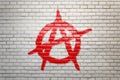 Anarchy sign painted on a white faience wall Royalty Free Stock Photo