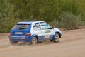 Anatoliy Kosarev drives a blue Citroen car during