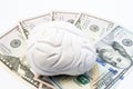 Anatomical model of human brain is on the money - US dollar banknotes. Concept photo to visualize cost of treatment brain diseases