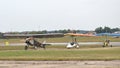 ANBO II vintage aircraft and two motor hang gliders taxiing